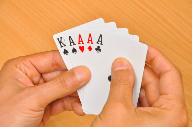 istock The man hold four aces in his hand. 855521298