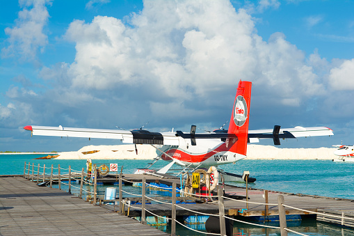 Male, Maldives - July 30, 2017: hydroplane near the wooden pier at the Male airport