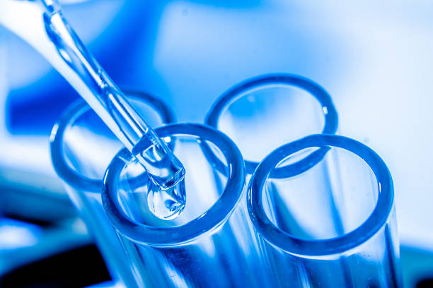 istock drop liquid  into a test tube 855537226