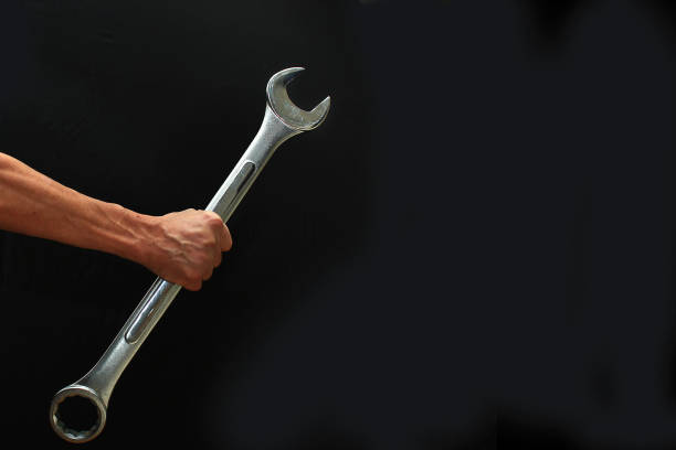 istock Mans hand holding a big wrench 855540562