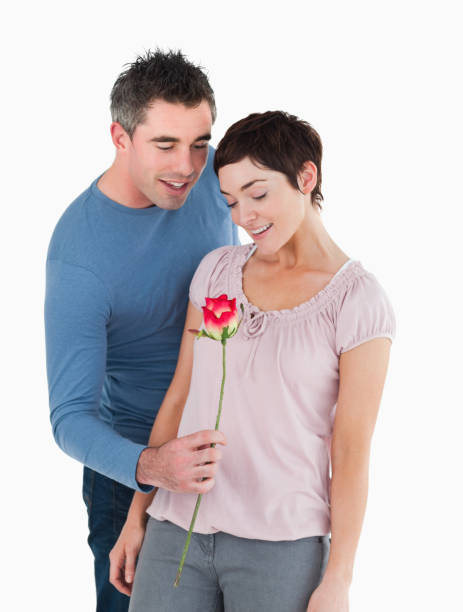istock Husband offering a rose to his wife 855543688