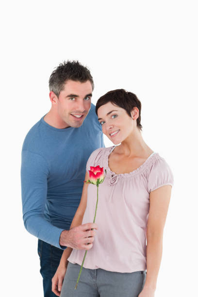 istock Man offering a rose to his wife 855543720