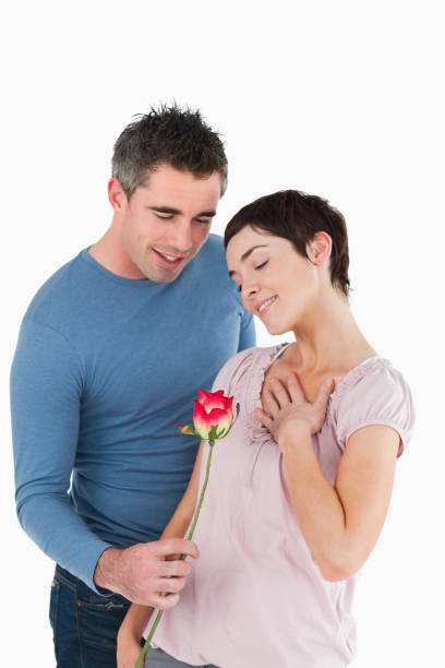 istock Husband offering a rose to his happy wife 855543744