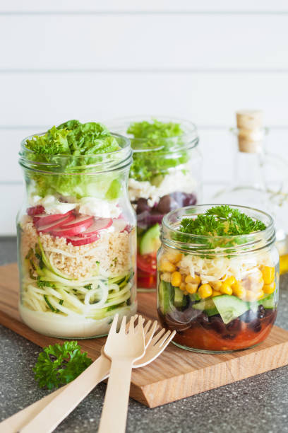 istock healthy vegetable and cheese salad in mason jars 855546662