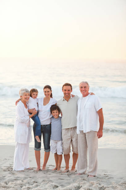 istock Beautiful family at the beach 855547236