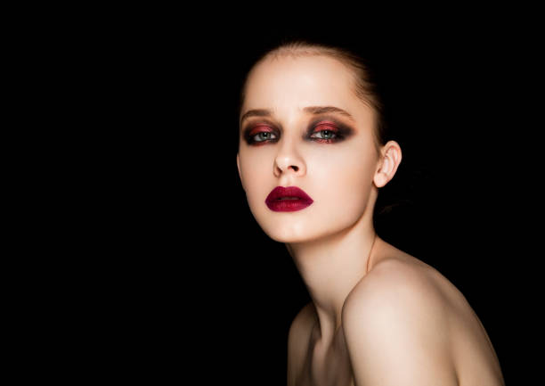 istock Beauty portrait red eyes and lips make up model 855547588