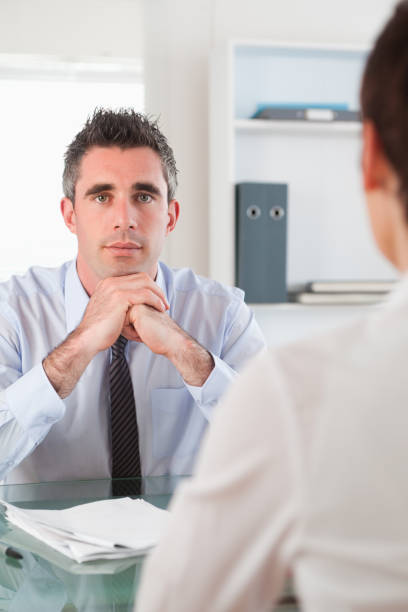 istock Portrait of a serious manager interviewing an applicant 855548760