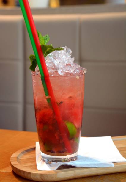 istock Mojito fresh cocktail drink with ice and mint on a glass. 855550374