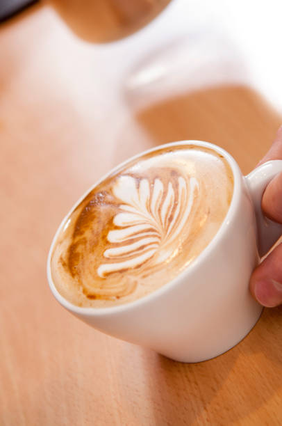 istock Latte Art in Espresso Cup on Wooden Surface 855551420