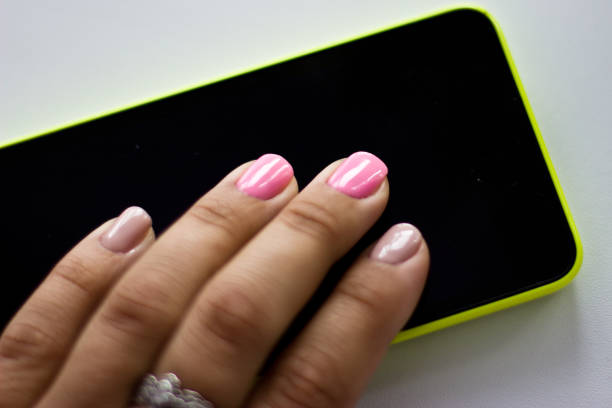 istock Hands with manicure. Nails covered with gel-varnish. 855553506