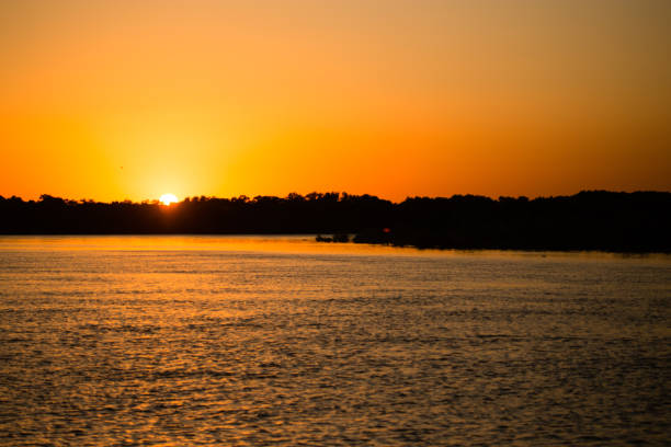 istock golden sunset on a river in the nature 855554320