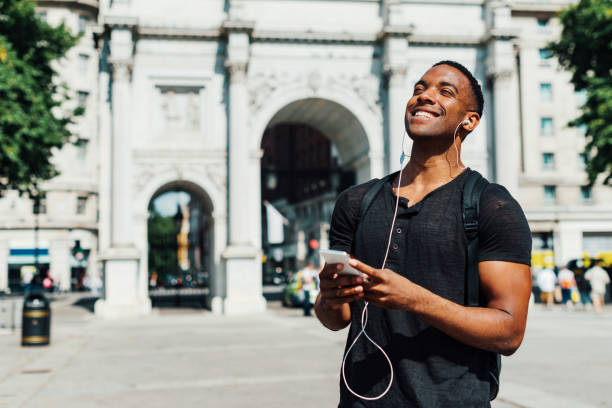 Handsome black guy in London enjoys the music