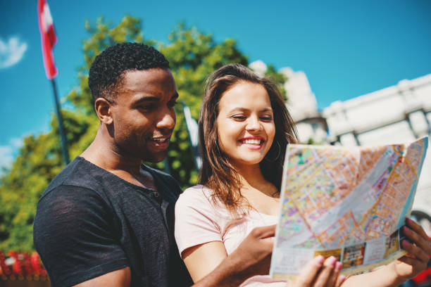 istock Multi ethnic couple looking at the map of London 855560122