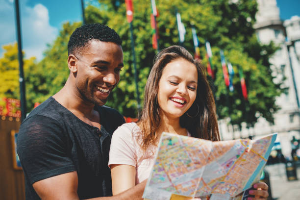 istock Multi ethnic couple looking for hostel in London while traveling 855560150