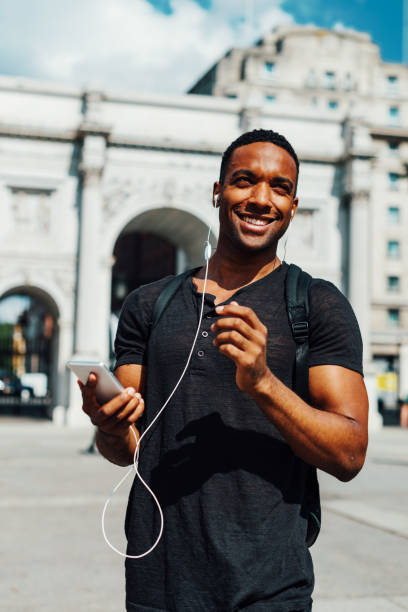 istock Handsome black guy in London enjoys sunny day 855560192