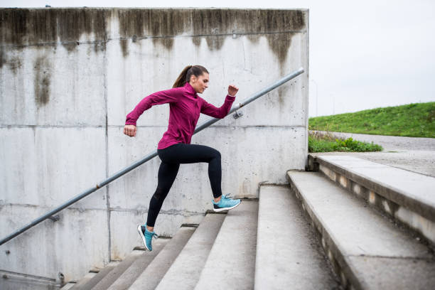 istock Woman running up the stairs 855563688