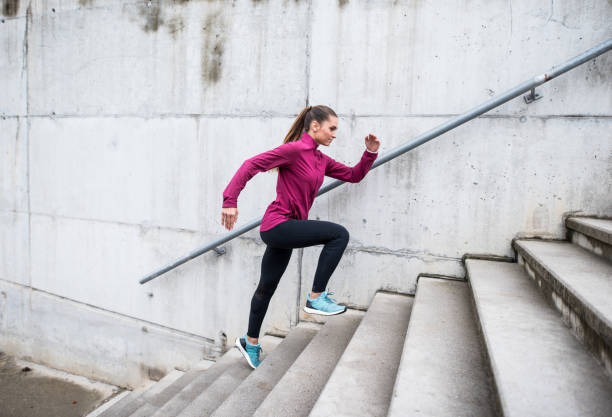 istock Woman running up the stairs 855563708