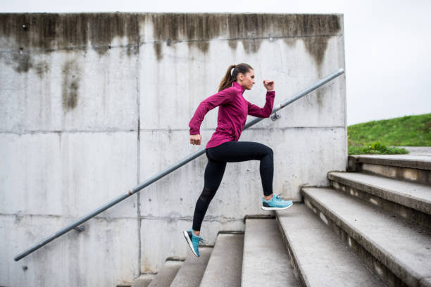 istock Woman running up the stairs 855564004