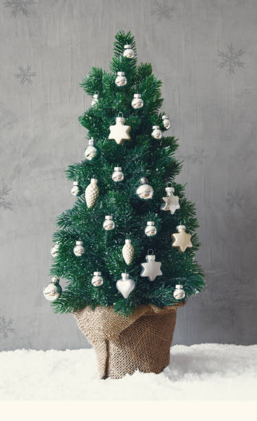 istock Vertical Tree, Snow, Silver Christmas Ball Ornament 855567528