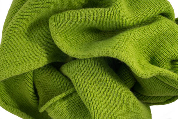 istock The texture of a knitted woolen fabric green. Background 855571224