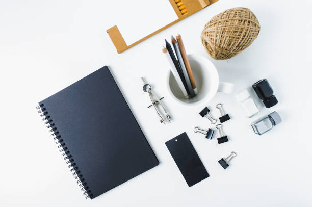 istock Sketchbook, pencils and office supplies on white background 855574532