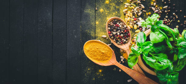 istock Various spices spoons on stone table. On a wooden board. Top view. Free space for your text. 855578136