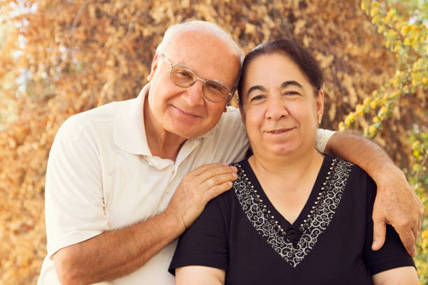 istock Senior couple embracing each other in backyard 855578502