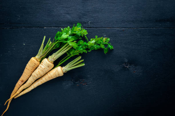 istock Parsley. Root parsley. On a wooden background. Top view. Free space for text. 855578810