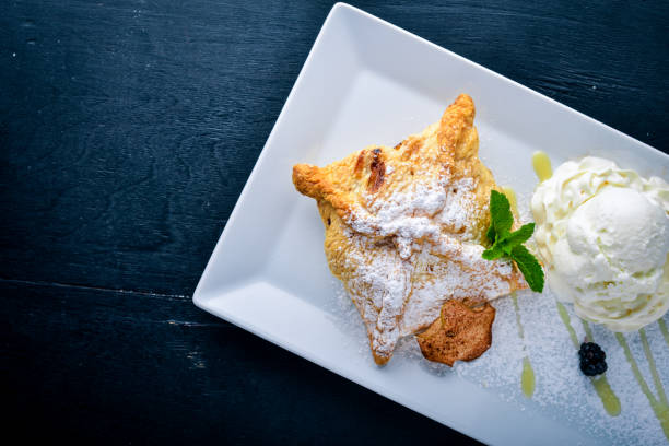 istock Apple Strudel with Ice Cream. On a wooden background. Top view. Free space for text. 855581754