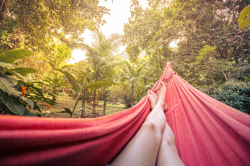 girl lying in a hammock in the tropical jungles of Brazil. Brasil