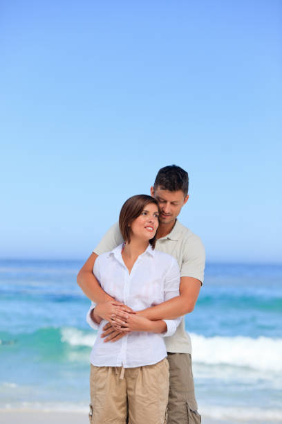 istock Lovely couple at the beach 855591094