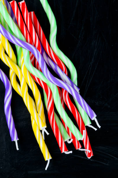 istock birthday candles on black background 855594508