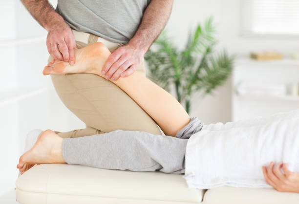 istock Masseur massaging womans foot 855601084