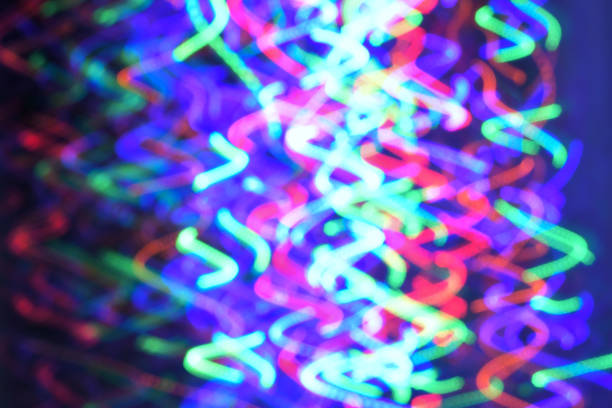 istock Multicolored bright LED lights blur in motion, festive New Year or Christmas abstract background. 855601126