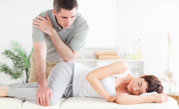 istock Masseur massaging womans hip 855603460