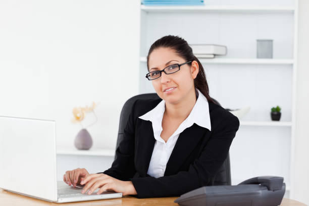 istock Young businesswoman at workplace 855604870