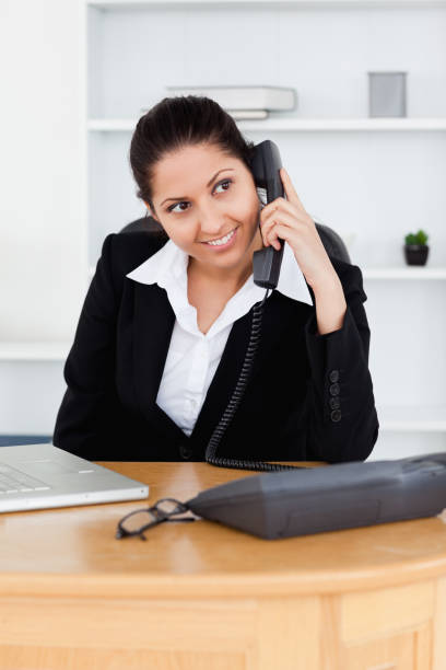 istock Smiling businesswoman telephoning 855605002