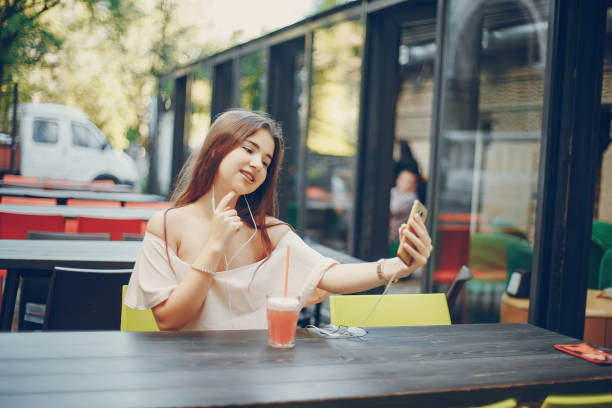 istock girl with cocktail 855605078