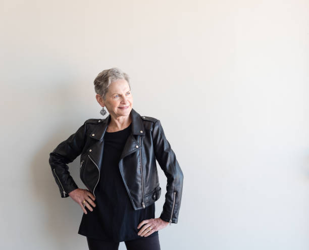 istock Older woman in black vinyl jacket 855608390