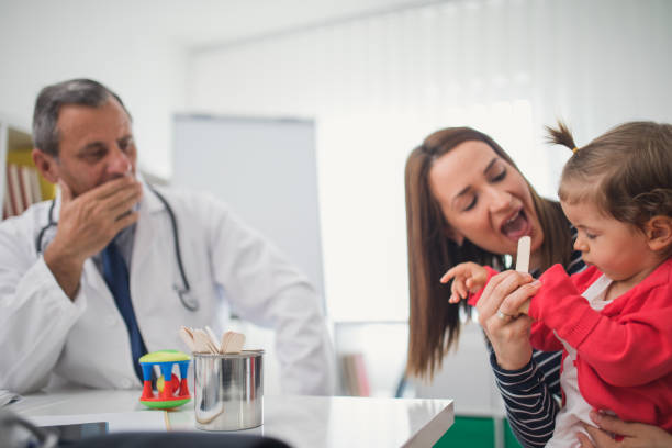 istock Little child visiting pediatrician 855608492