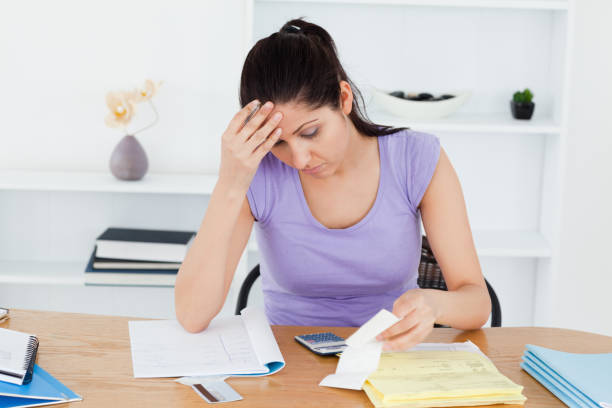 istock Frustrated young woman accounting 855611678