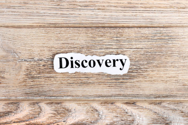 istock Discovery text on paper. Word Discovery on torn paper. Concept Image 855621720