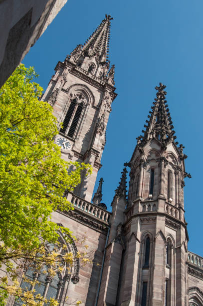 tower of the temple st Etienne in Mulhouse closeup of bell tower of the temple st Etienne in Mulhouse mulhouse photos stock pictures, royalty-free photos & images