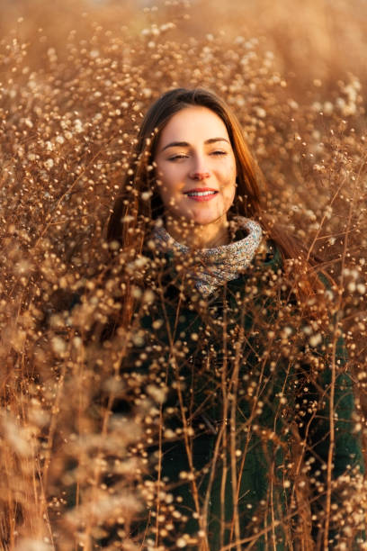 istock Young woman outdoors  in a field 855629146