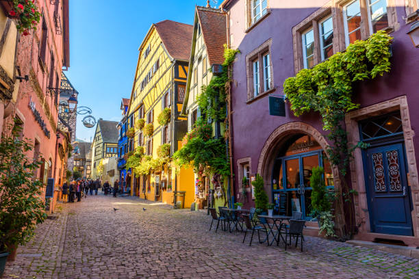 Beautiful village Riquewihr with historic buildings and colorful houses in Alsace of France - Famous vine route Beautiful village Riquewihr with historic buildings and colorful houses in Alsace of France - Famous vine route - travel destination for vacation alsace stock pictures, royalty-free photos & images