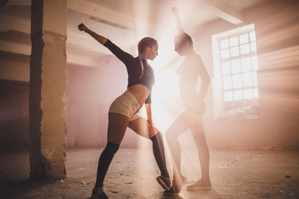 istock Women dancers in abandoned warehouse 855637334