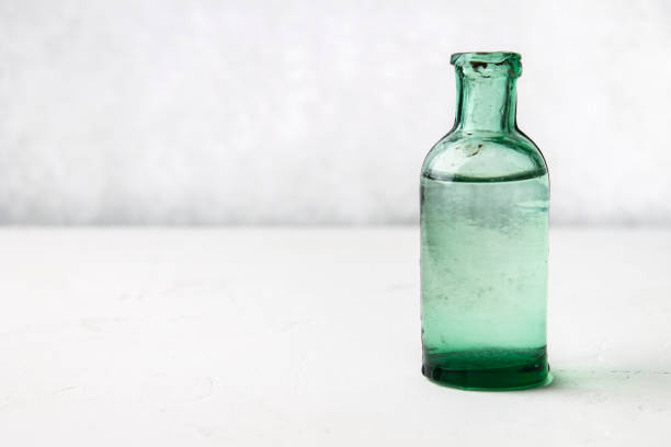 istock vintage glass bottles on a light background 855637596
