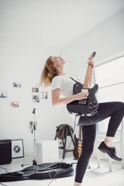 istock Beautiful woman playing guitar 855637816