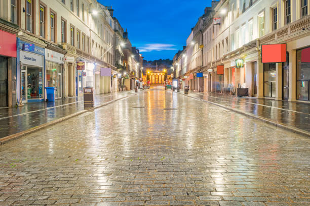istock Cobbled street with storefronts in downtown Dundee Scotland UK 855637926