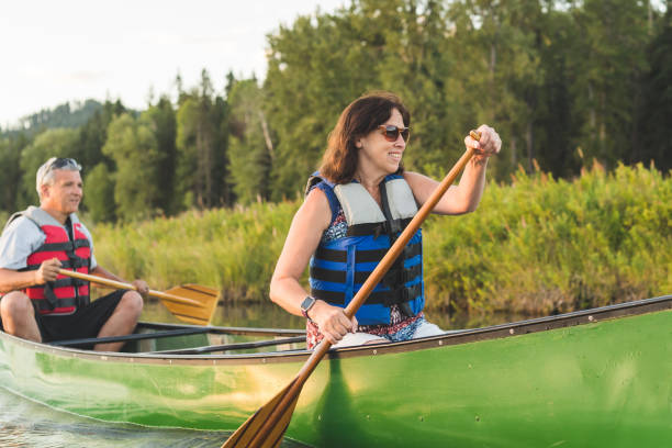 istock Canoeing Together on a Beautiful Lake 855638230